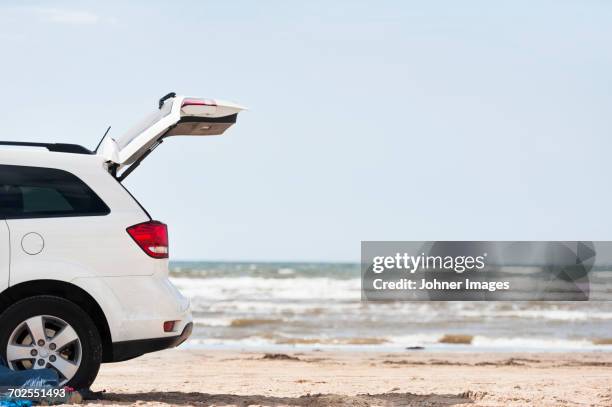 car with open trunk on beach by sea - beach car stock pictures, royalty-free photos & images