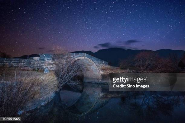 chinese bridge at night - dali universe stock pictures, royalty-free photos & images