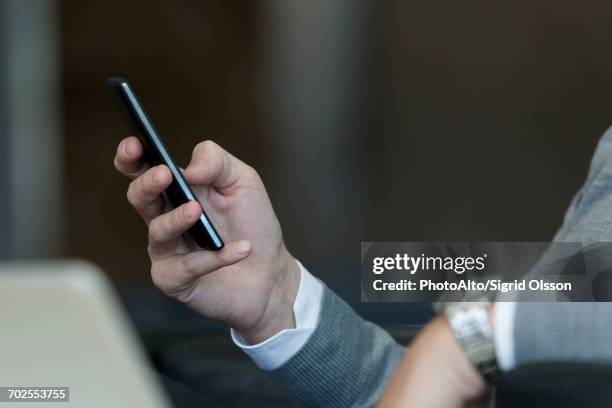 Hand Holding Phone Side Photos and Premium High Res Pictures - Getty Images
