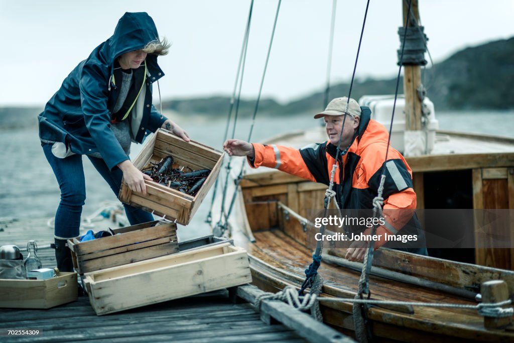 People unloading boat