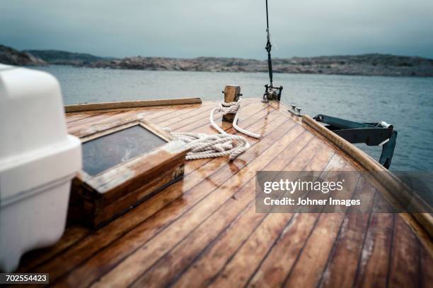 wooden boat on sea - grebbestad stockfoto's en -beelden