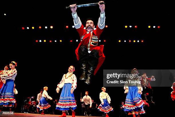 Dancers with the Russian Cossack State Song And Dance Ensemble rehearse February 27, 2002 in the Peacock Theatre in London prior to their first...