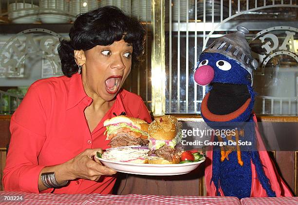 Actress Sonia Manzano, who plays Maria Rodriquez on the childrens television show "Sesame Street," and the muppet Grover lauch the new "Super Grover"...