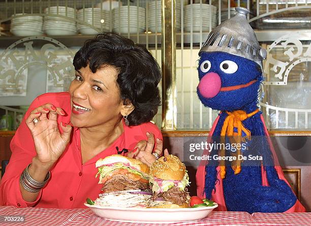 Actress Sonia Manzano, who plays Maria Rodriquez on the childrens television show "Sesame Street," and the muppet Grover lauch the new "Super Grover"...