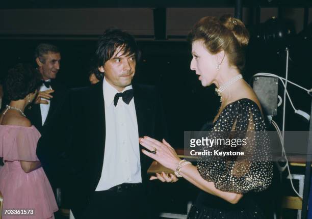 English photographer David Bailey talking to Princess Alexandra, The Honourable Lady Ogilvy, at a charity ball for the launch of Patrick Lichfield's...