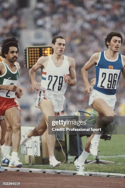 East German athlete Andreas Busse leads English middle distance athlete Steve Ovett of the Great Britain team in heat 1 of the semifinals of the...