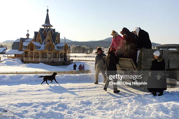 Parishioners arrive at the Vissarion Church of the Last Testament in Petropavlovka, East Siberia, Russia March 1, 2002 for a sermon by Vissarion , a...