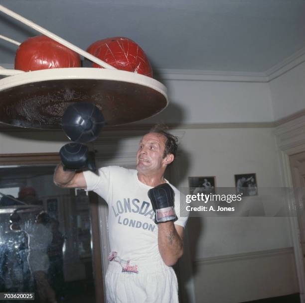 English heavyweight boxer Henry Cooper in training, UK, February 1971.