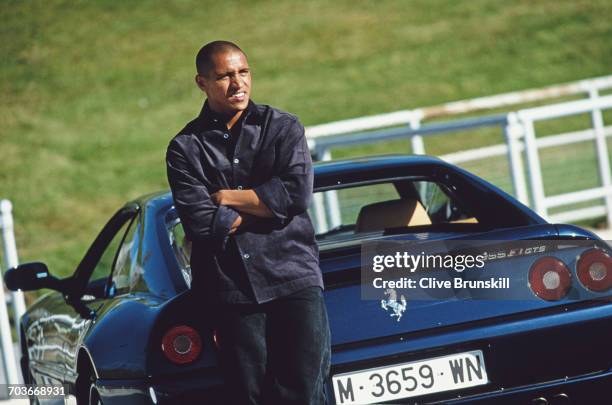 Roberto Carlos of Brazil and Real Madrid Football Club poses for a portrai talongside a Ferrari 355 F1 GTS for soft drinks manufacturer Pepsi-Cola on...