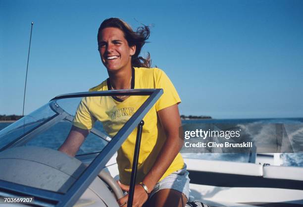 Amelie Mauresmo of France poses for a portrait driving a power speedboat off the coast of Miami during the ATP Lipton Tennis Championship on 10 March...