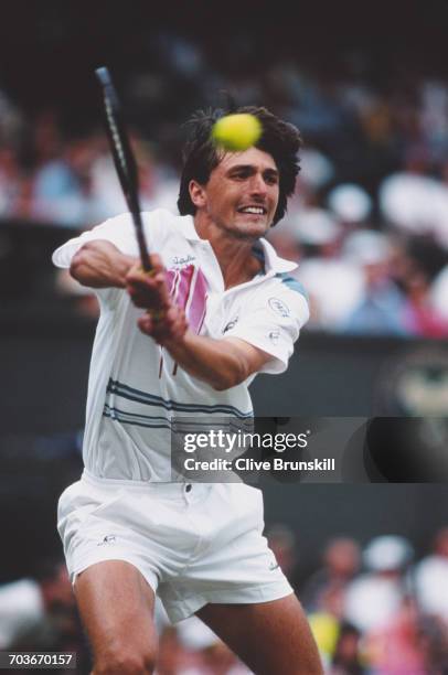 Goran Ivanisevic of Croatia makes a double backhand return against Pete Sampras during their Men's Singles Final match at the Wimbledon Lawn Tennis...