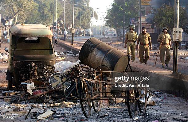 Indian state police patrol the streets of Ahmadabad, India after rioting between Muslims and Hindus March 1, 2002 in Ahmadabad, India, two days after...