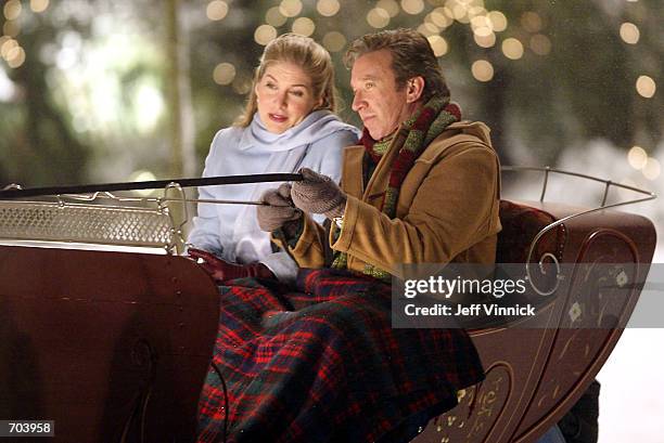 Actors Elizabeth Mitchell and Tim Allen act in a scene on the set of their upcoming film, "Mrs. Clause: The Santa Clause 2" February 28, 2002 in...