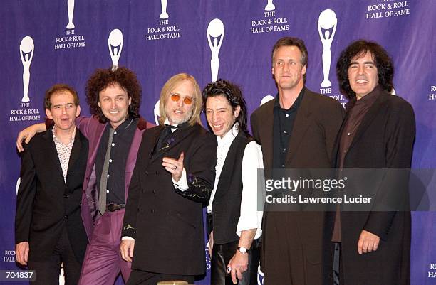 Members of the music group Tom Petty and the Heartbreakers attend the 17th Annual Rock and Roll Hall of Fame Induction Ceremony March 18, 2002 in New...