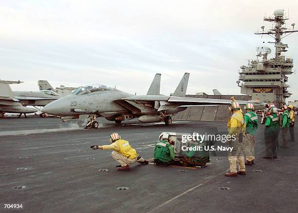 An F-14 "Tomcat" prepares to launch March 19, 2002 from the flight deck of the aircraft carrier USS John F. Kennedy. The Kennedy is conducting combat...