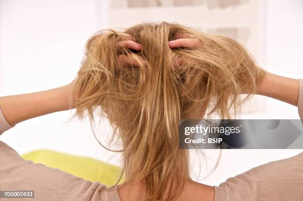 itching in an adolescent - scratching scalp stock pictures, royalty-free photos & images
