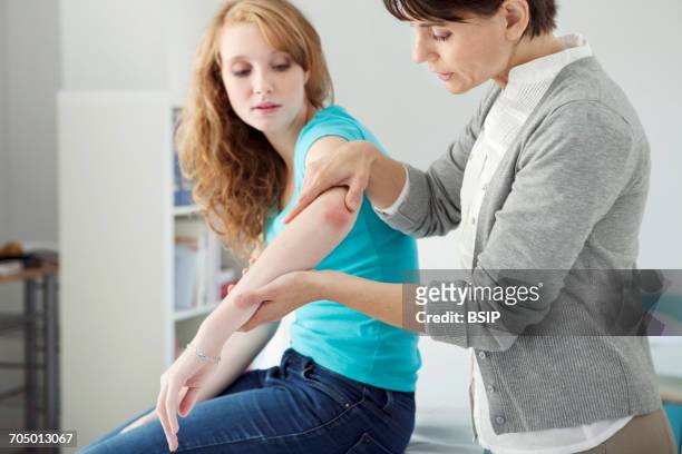 dermatology consultation woman - human joint foto e immagini stock