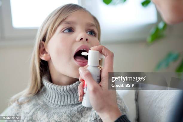 Using Mouth Spray 223 Mouth Spray Stock Photos, High-Res Pictures, and Images - Getty Images