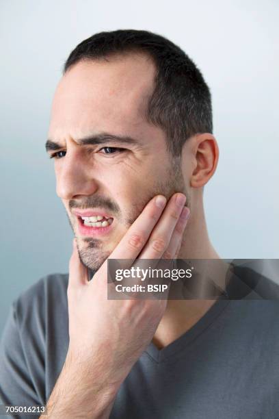 man with toothache - bruxism stock pictures, royalty-free photos & images