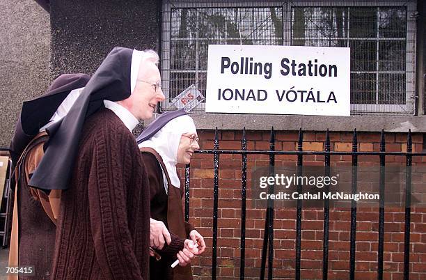 Three Carmelite Nuns walk to their local polling station March 6, 2002 in Drumcondra, Dublin. Irish voters are expected to cast their vote in the...