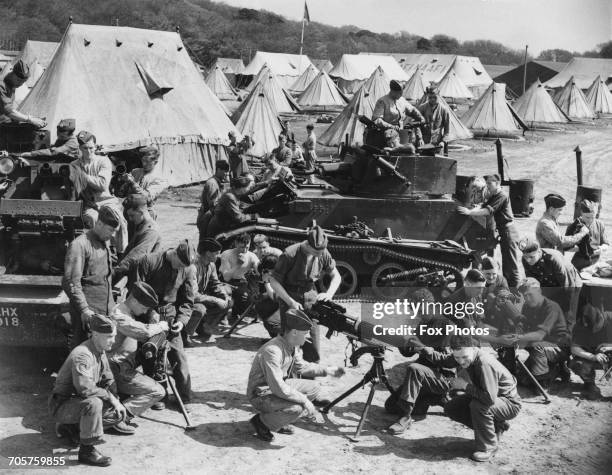 Recruits at work on assembling and maitenence of their British Vickers Light Tank Mk.IV tanks and weapons at the Army Fighting Vehicles School at...