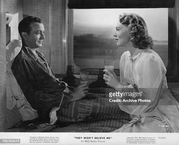 American actors Robert Young as Larry Ballentine, and Rita Johnson as his wife, Greta, in a publicity still for Irving Pichel's film noir, 'They...