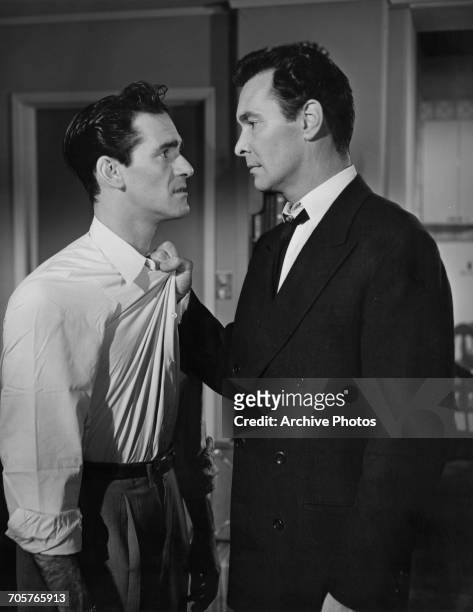 American actors Danny Dayton as Harry Dycker, and Barry Sullivan in a publicity still for 'No Questions Asked ', directed by Harold F. Kress, 1951.