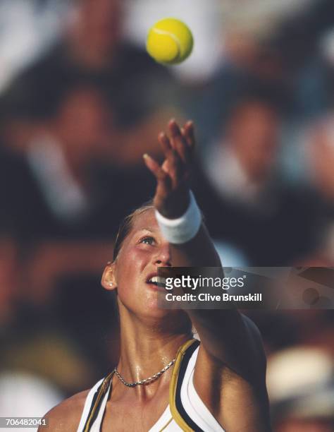 Anna Kournikova of Russia serves against Silvia Farina Elia during the Women's Singles first round match of the Sydney International tennis...