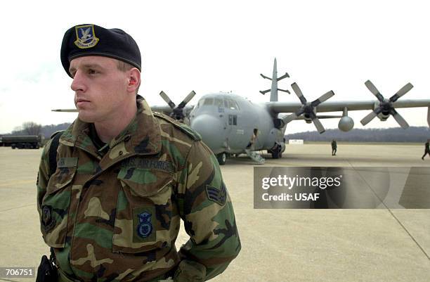 Senior Airman Jonathan Clark, from the Pennsylvania Air National Guard's 193rd Special Operations Wing security forces squadron, stands guard by an...