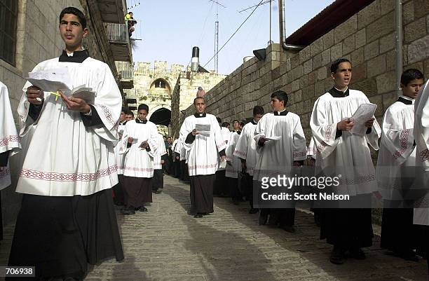 Thousands of Christian Pilgrims in Jerusalem celebrate Palm Sunday March 24, 2002 by retracing the steps of Jesus Christs historic entrance into the...