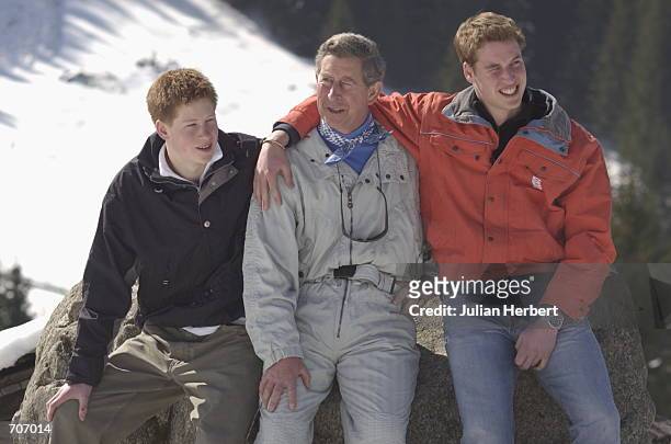 Prince Charles and his sons William and Harry appear at a photocall March 29, 2002 in the Swiss village of Klosters at the start of his annual sking...