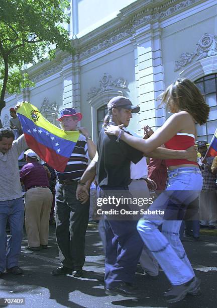Supporters of Venezuelan President Hugo Chavez celebrate by dancing the national dance known as Joropo in front of Miraflores presidential palace...