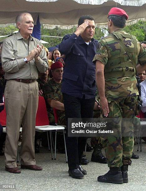 Venezuelan President Hugo Chavez salutes his loyal 42 Brigade of Infantry of Parachutists Commander Raul Baduel as Defense Minister Jose Vicente...