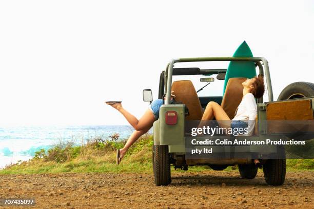 women laughing in off-road vehicle - beautiful asian legs stock pictures, royalty-free photos & images