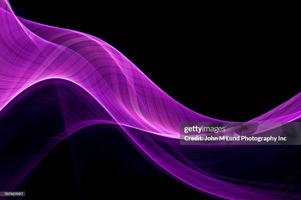 Flowing purple abstract light beams
