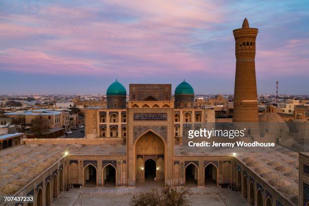 kalon mosque and minaret at dusk, bukhara, uzbekistan - asia central fotografías e imágenes de stock