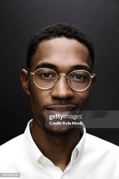 portrait of smiling black man wearing eyeglasses - black background portrait stock pictures, royalty-free photos & images