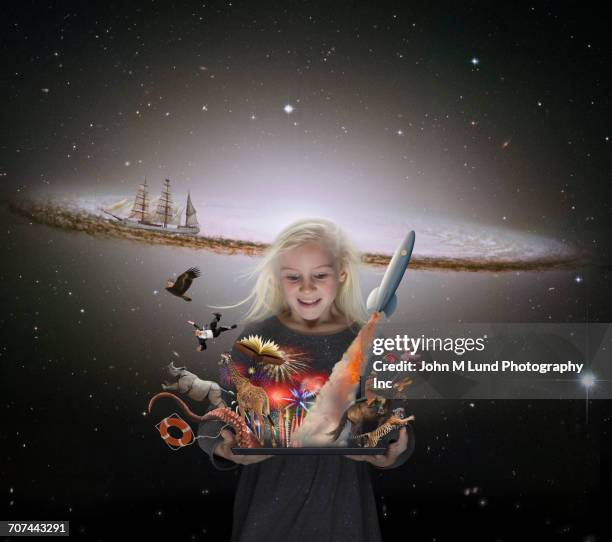caucasian girl imagining adventures in outer space - kids imagination imagens e fotografias de stock