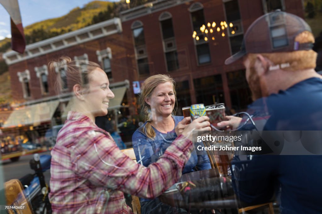 Friends having toast in bar