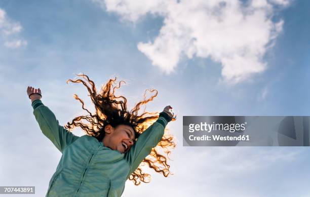 girl jumping in the air - kid jumping stock-fotos und bilder