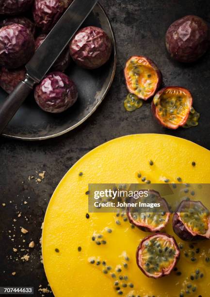 tropical fruits on table - passievrucht stockfoto's en -beelden