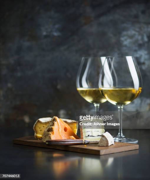 cheese platter and white wine - cheese and wine stock-fotos und bilder