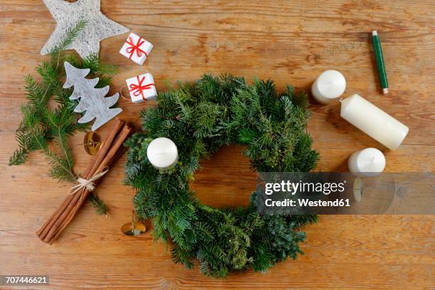 preparing of an advent wreath - advent wreath stock pictures, royalty-free photos & images