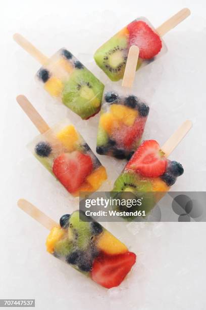 six fruit ice lollies with fresh fruits on white ground - ice lolly stock pictures, royalty-free photos & images