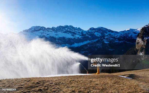 switzerland, portes du soleil, champery, active snow cannon - fake snow stock pictures, royalty-free photos & images