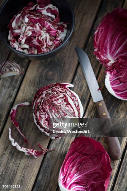 sliced and chopped radicchio on wood - radicchio stock pictures, royalty-free photos & images