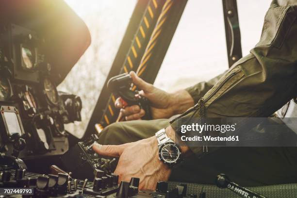 close-up of pilot in cockpit of a helicopter - helicopter cockpit stock pictures, royalty-free photos & images