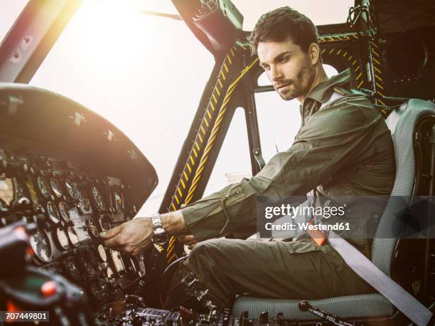 pilot in cockpit of a helicopter - beard pilot stock pictures, royalty-free photos & images