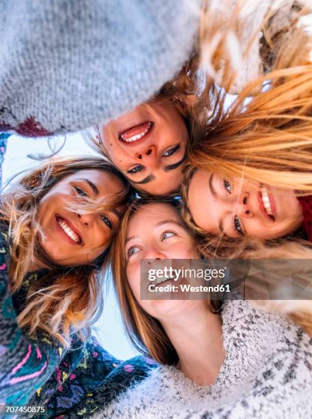 portrait of four happy friends head to head - girl sticking out tongue stock pictures, royalty-free photos & images