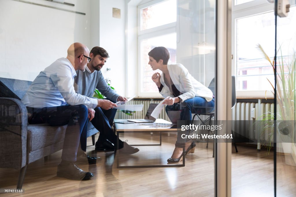 Colleagues working together in boardroom